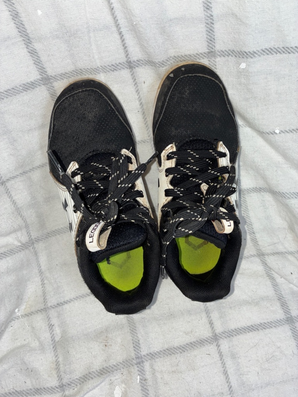 Boys under armour sports cleats size 13 with Neon Green Insole